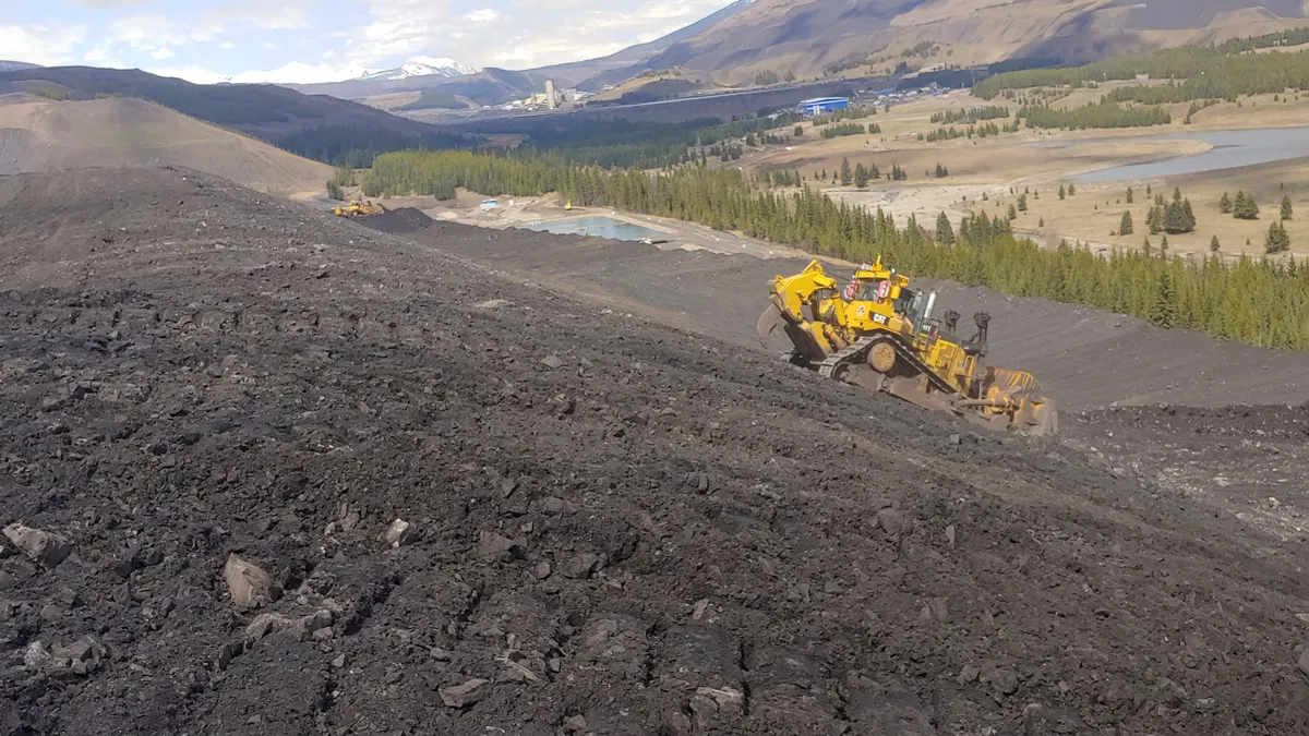 Heavy civil equipment working on an earthworks project in the mountains
